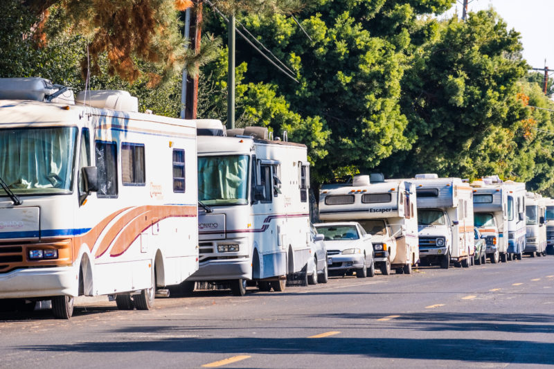 multiple R.V.s parked on street